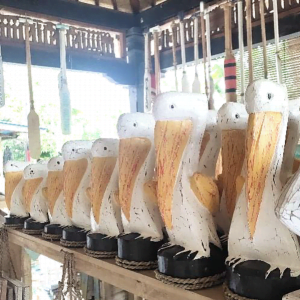 A Set Of 3 Wooden Pelican